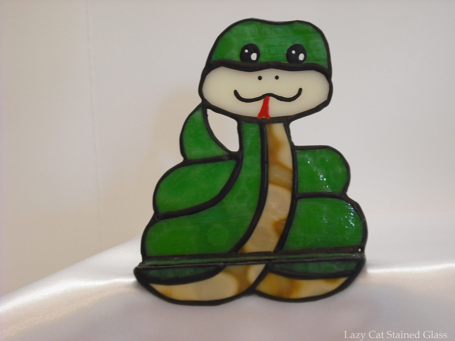 Snake shelf sitter