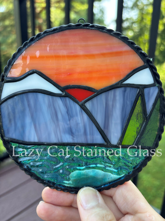 Sunset Over Peaks – Circular Stained Glass Landscape