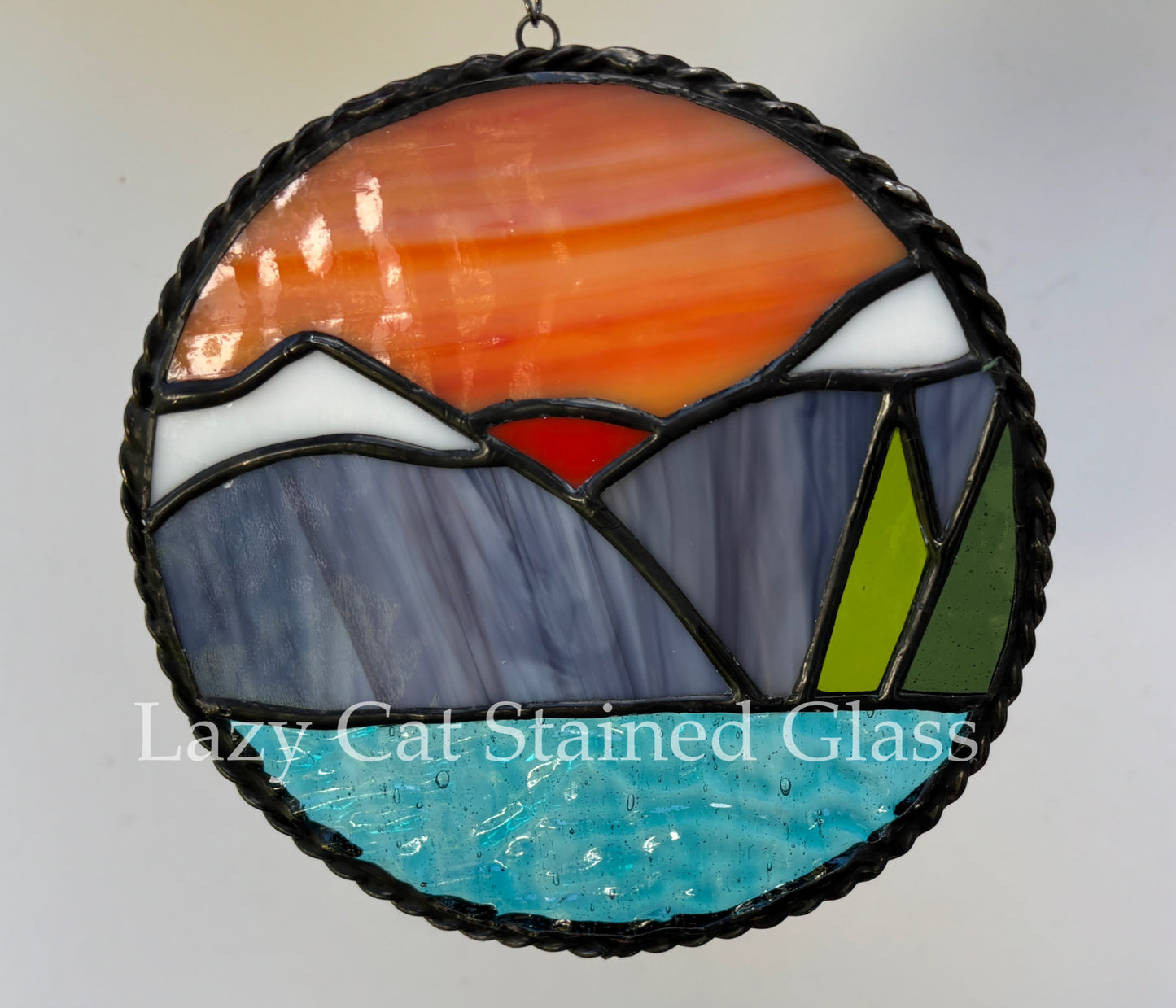 Sunset Over Peaks – Circular Stained Glass Landscape