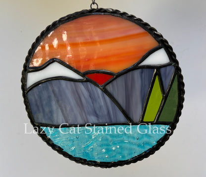 Sunset Over Peaks – Circular Stained Glass Landscape